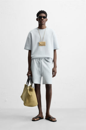 TECHNICAL INTERLOCK BERMUDA SHORTS - Image 1