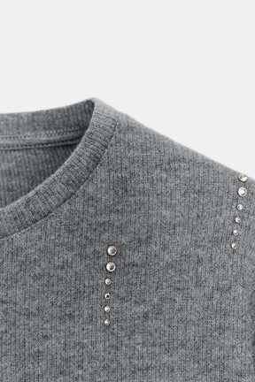 Glitzernder Rippenpullover