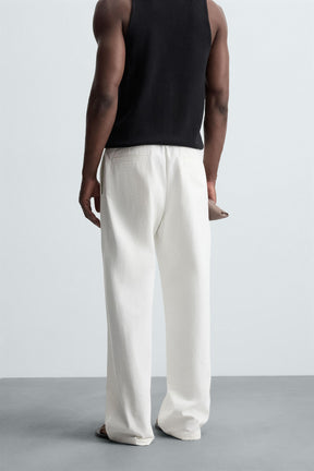 RELAXED FIT PLEATED TROUSERS - Image 3