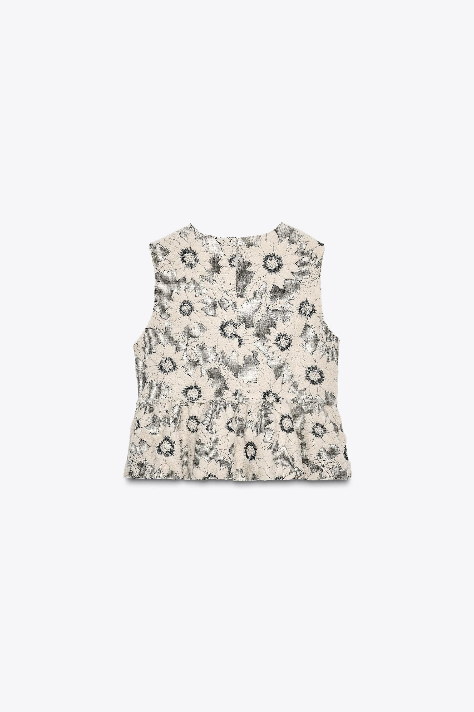 FLORAL TEXTURED PEPLUM TOP