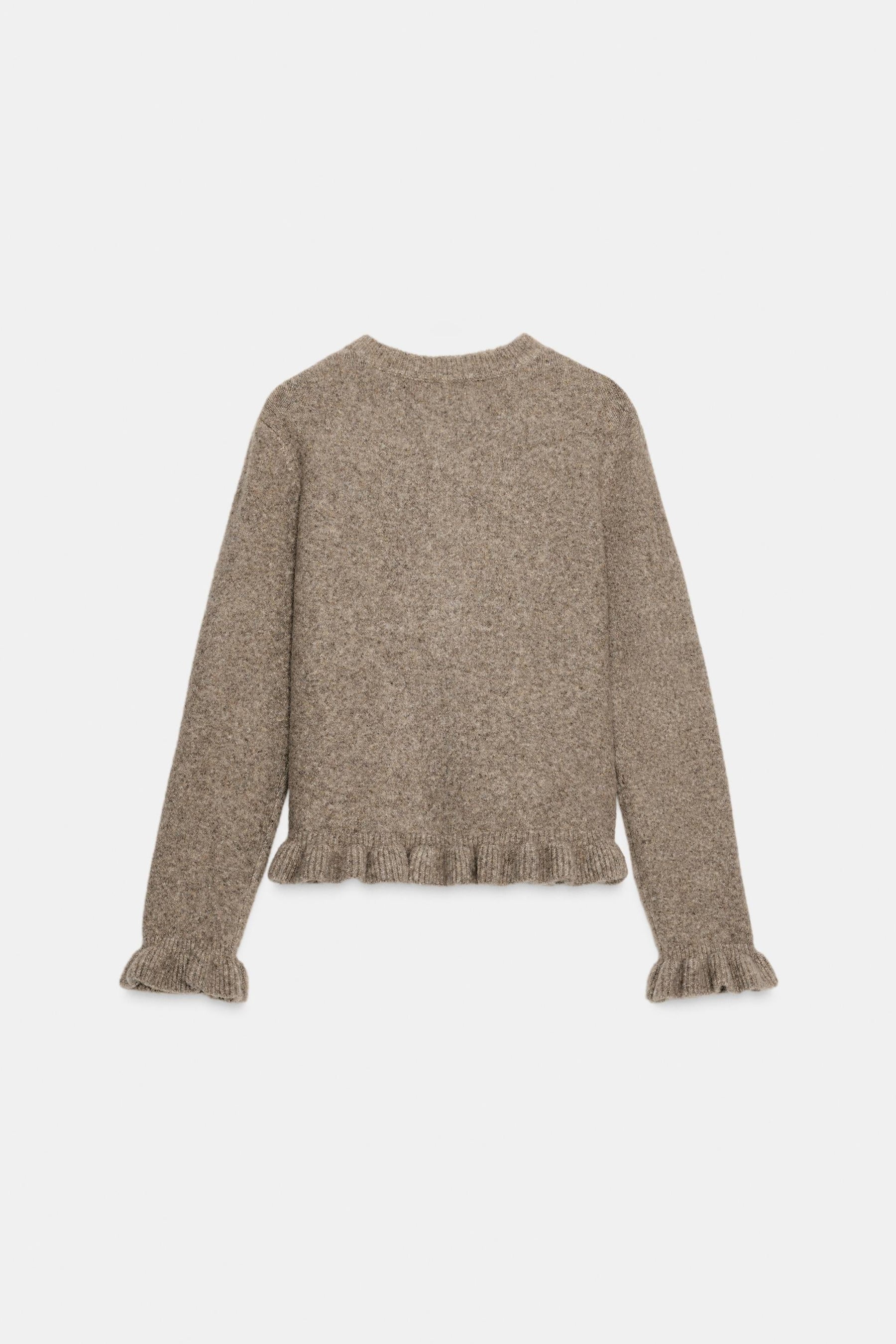 Strickjacke mit Rüschenbesatz