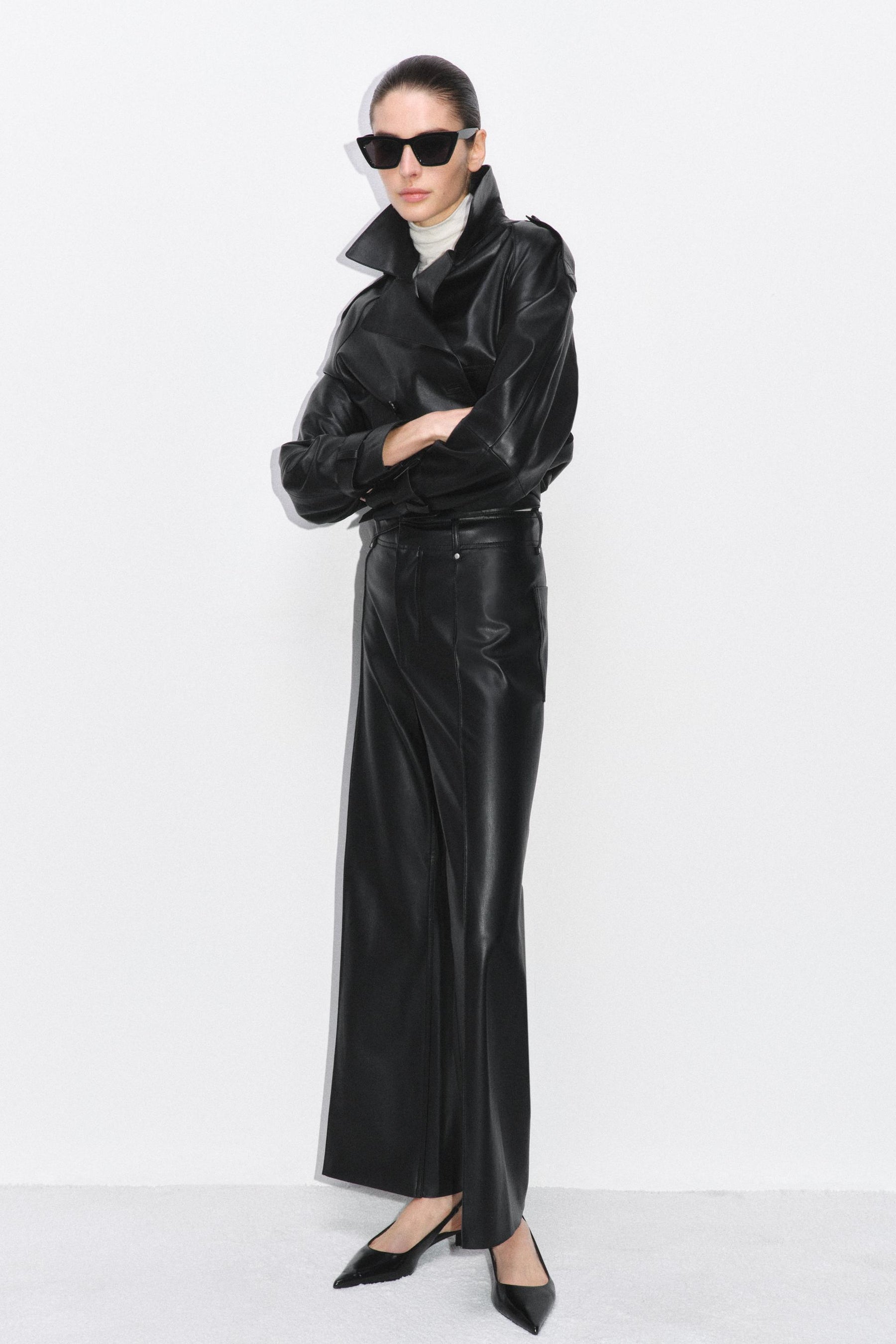 Tailored wide-leg leather-effect trousers.