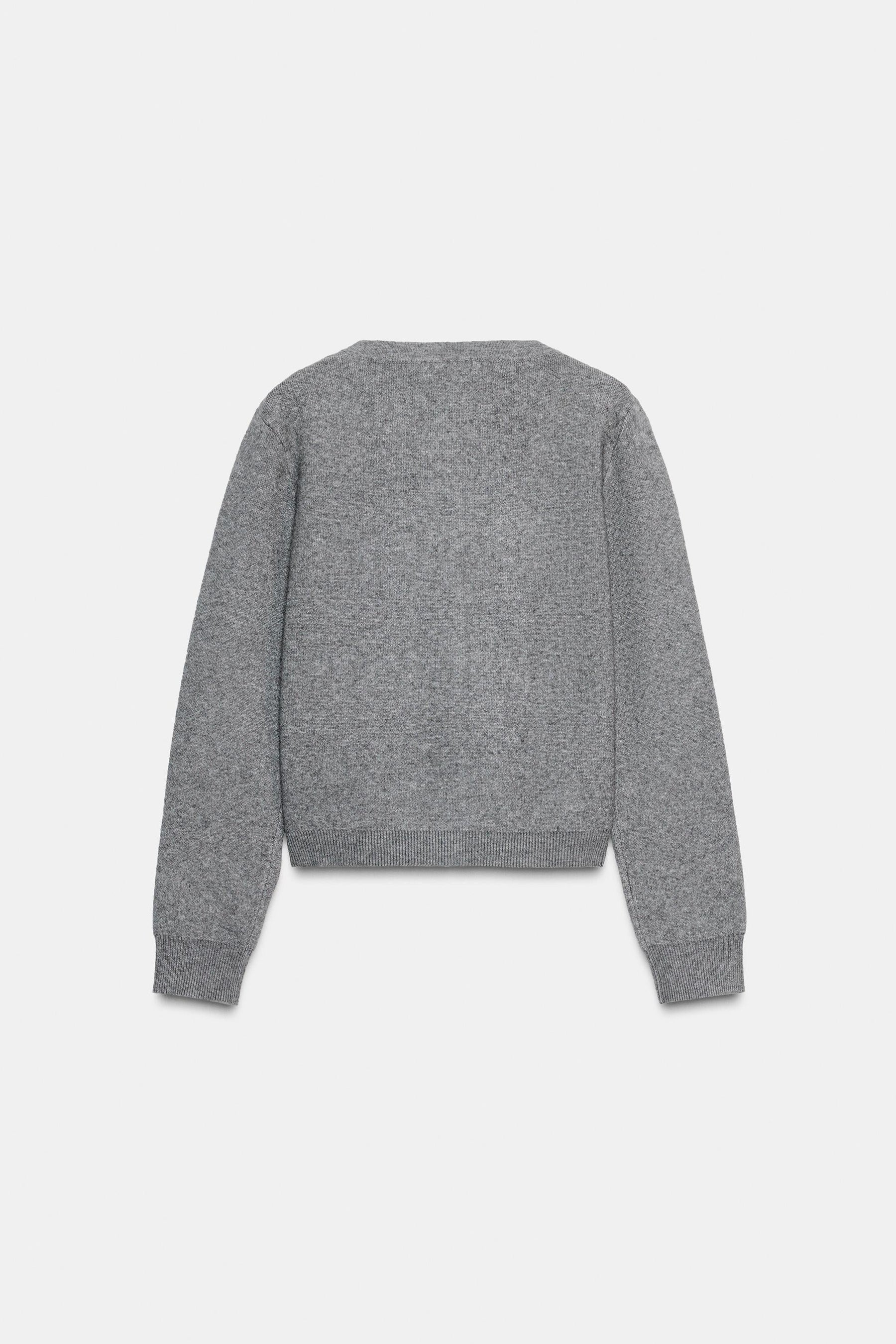 Perlenbesetzte Strickjacke
