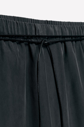 Silk trousers with belt.