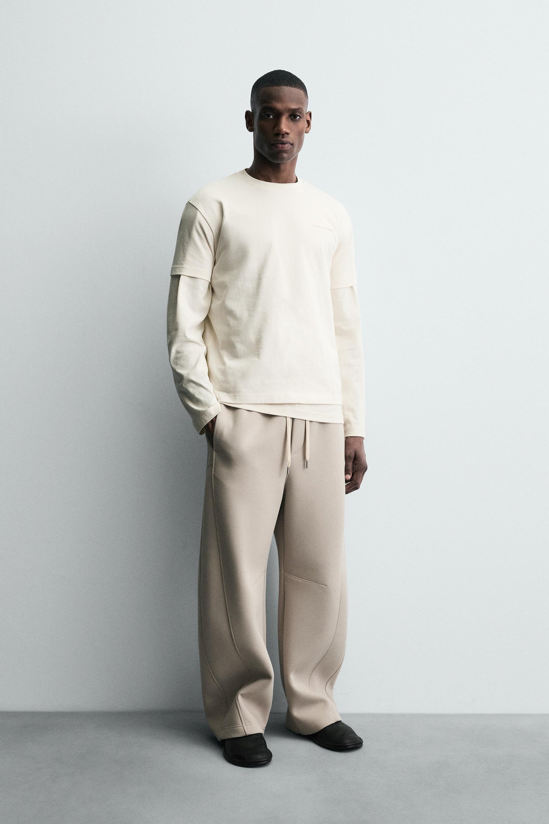 T-SHIRT WITH RAISED TEXT - Image 1