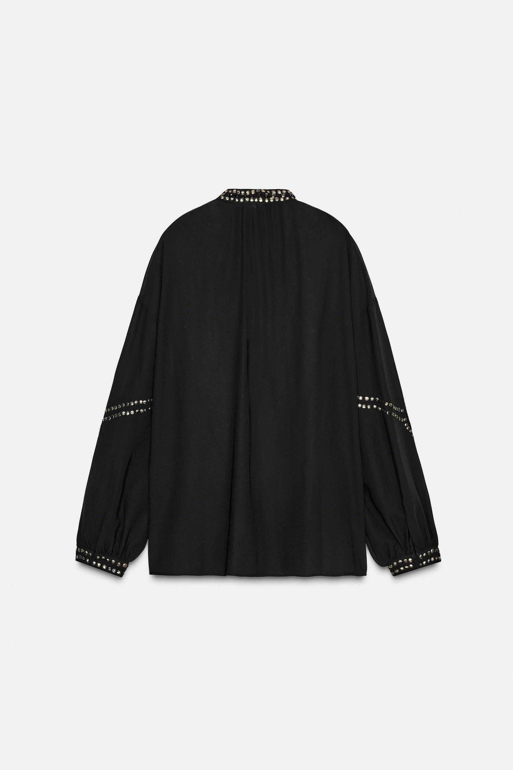Perlenbesetzte, halbtransparente Bluse