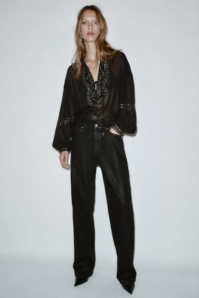 Perlenbesetzte, halbtransparente Bluse