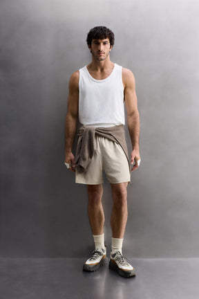 CONTRAST PERFORATED SHORTS - Image 1