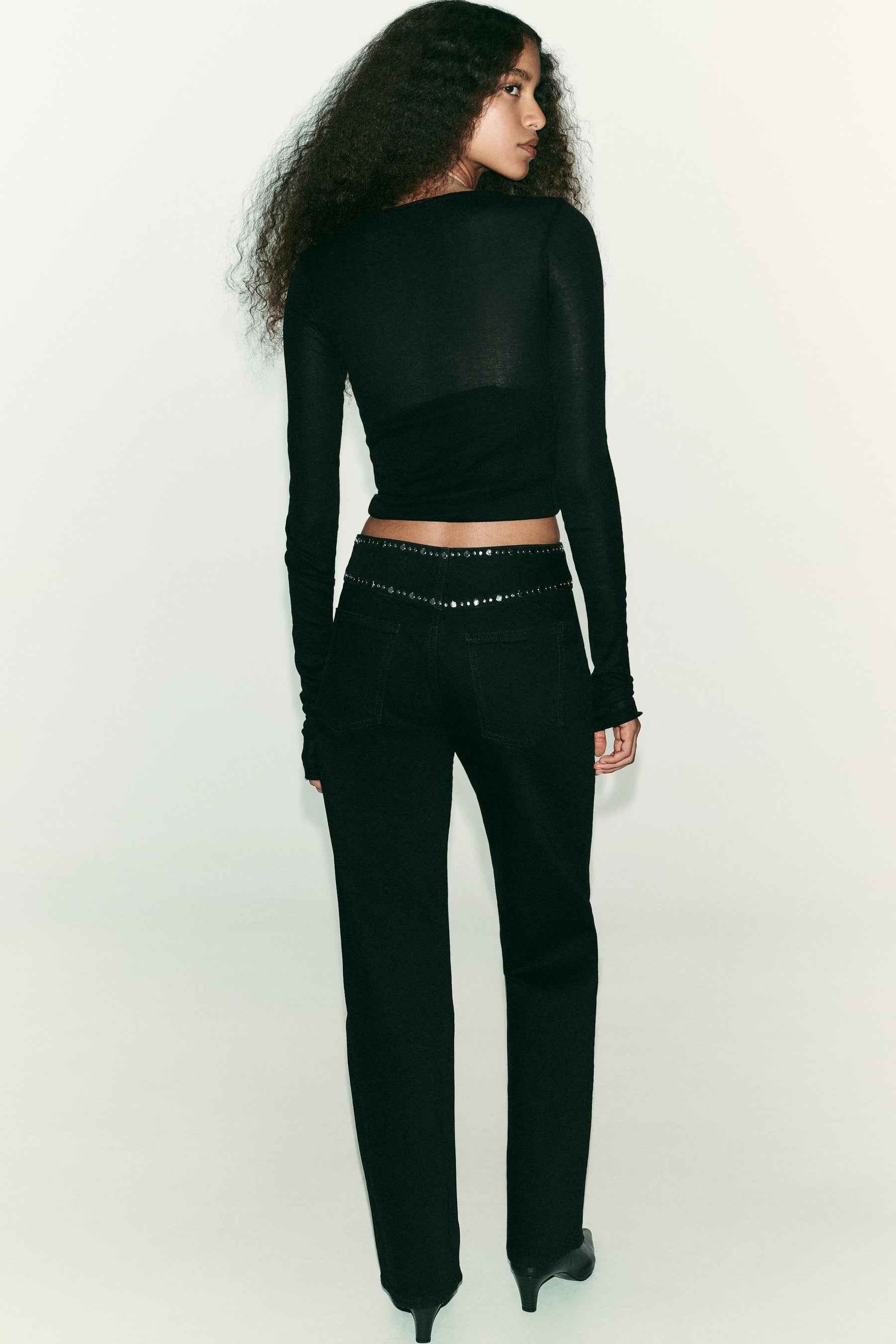 High-waist studded jeans