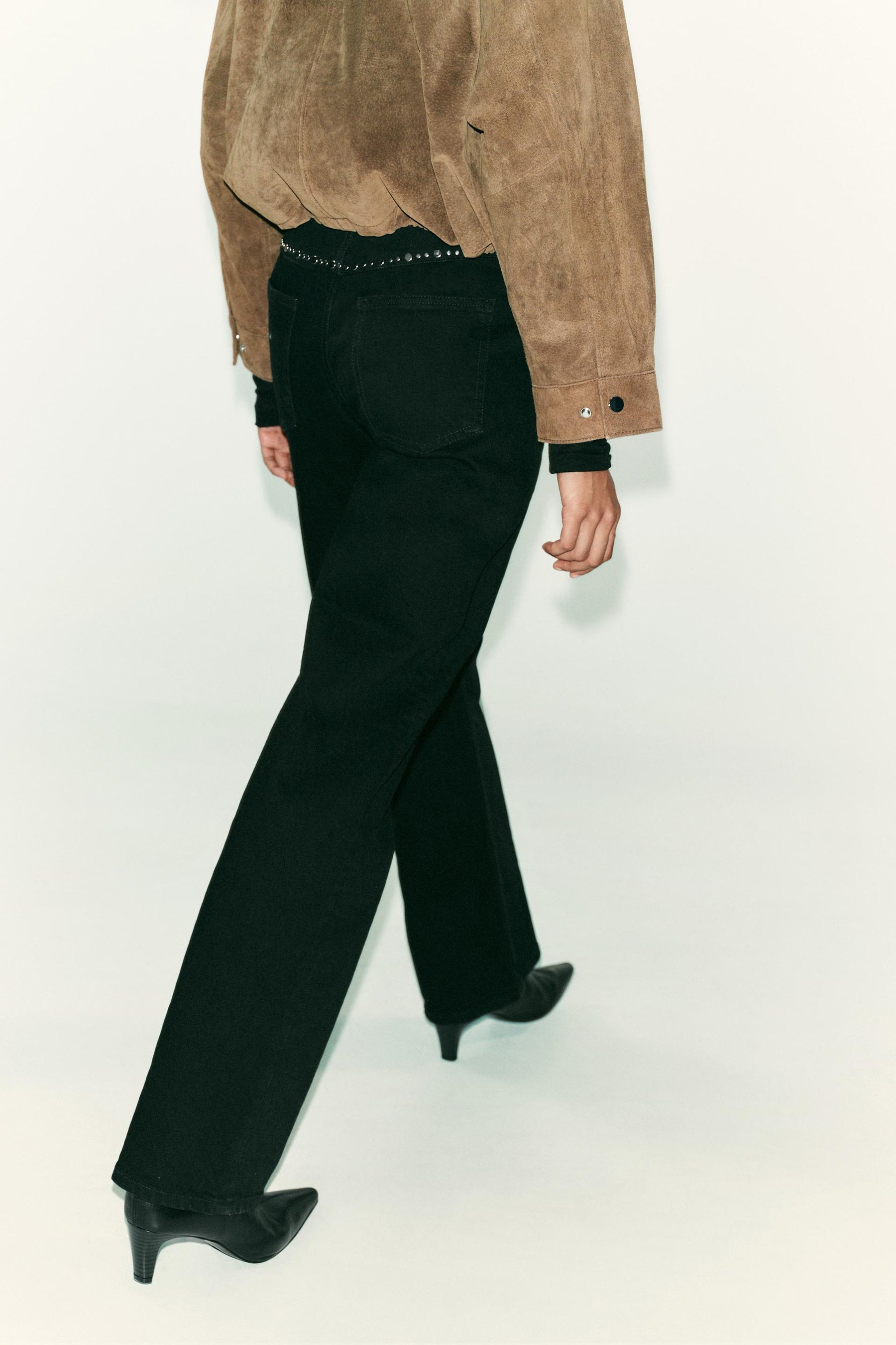 High-waist studded jeans