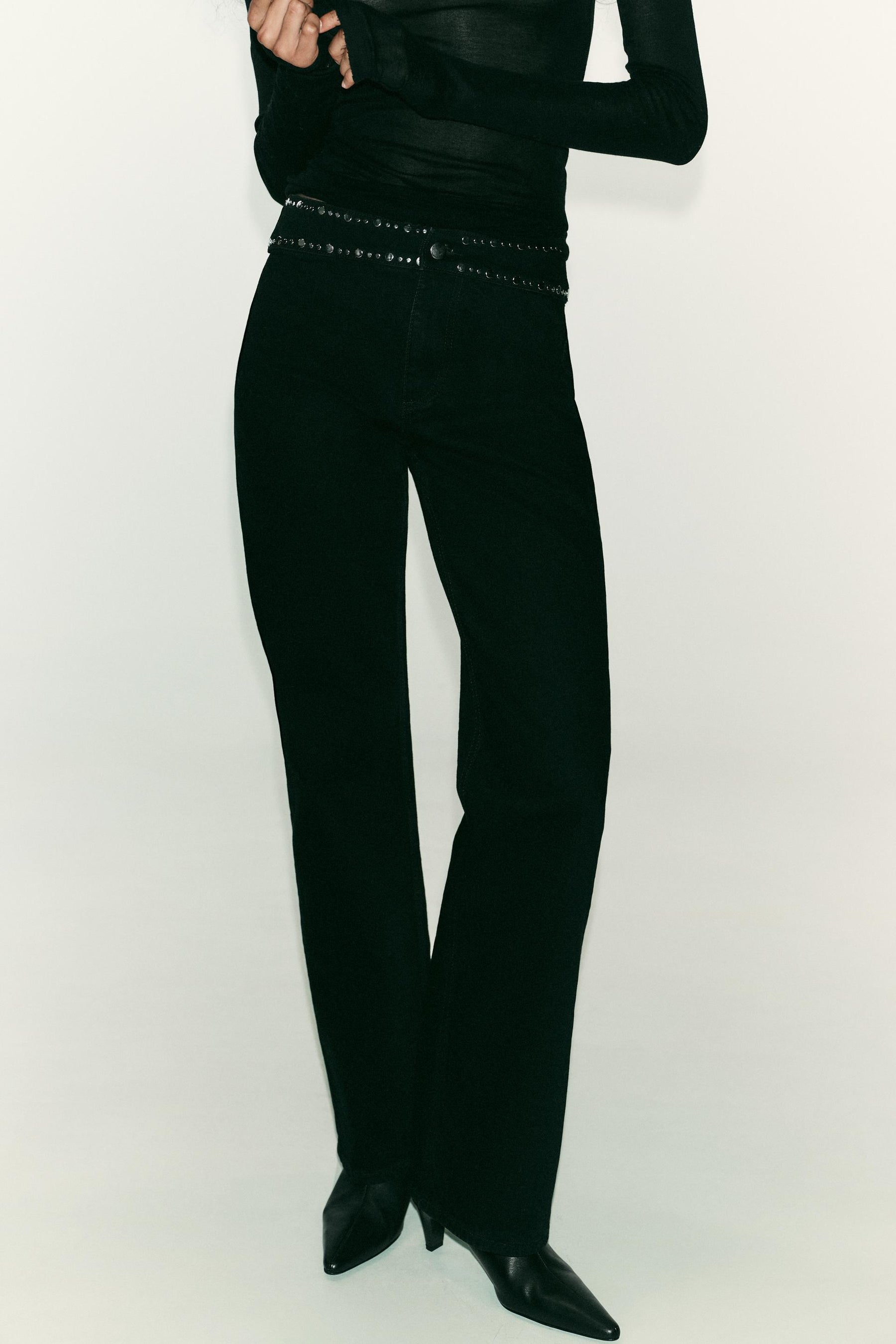 High-waist studded jeans