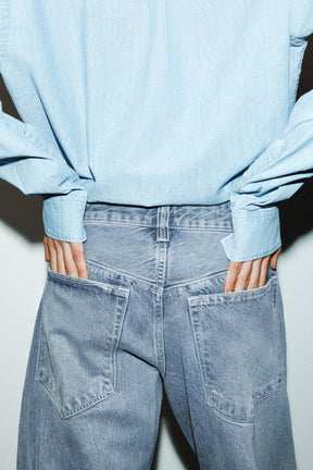 Cropped jeans with displaced
