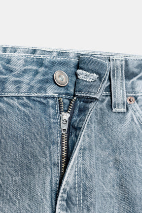 Cropped jeans with displaced