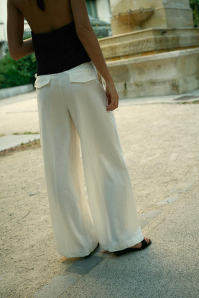 PLEATED TROUSERS WITH FLAPS
