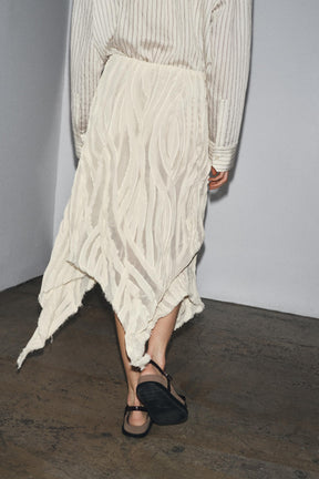 ASYMMETRIC PLEATED SKIRT