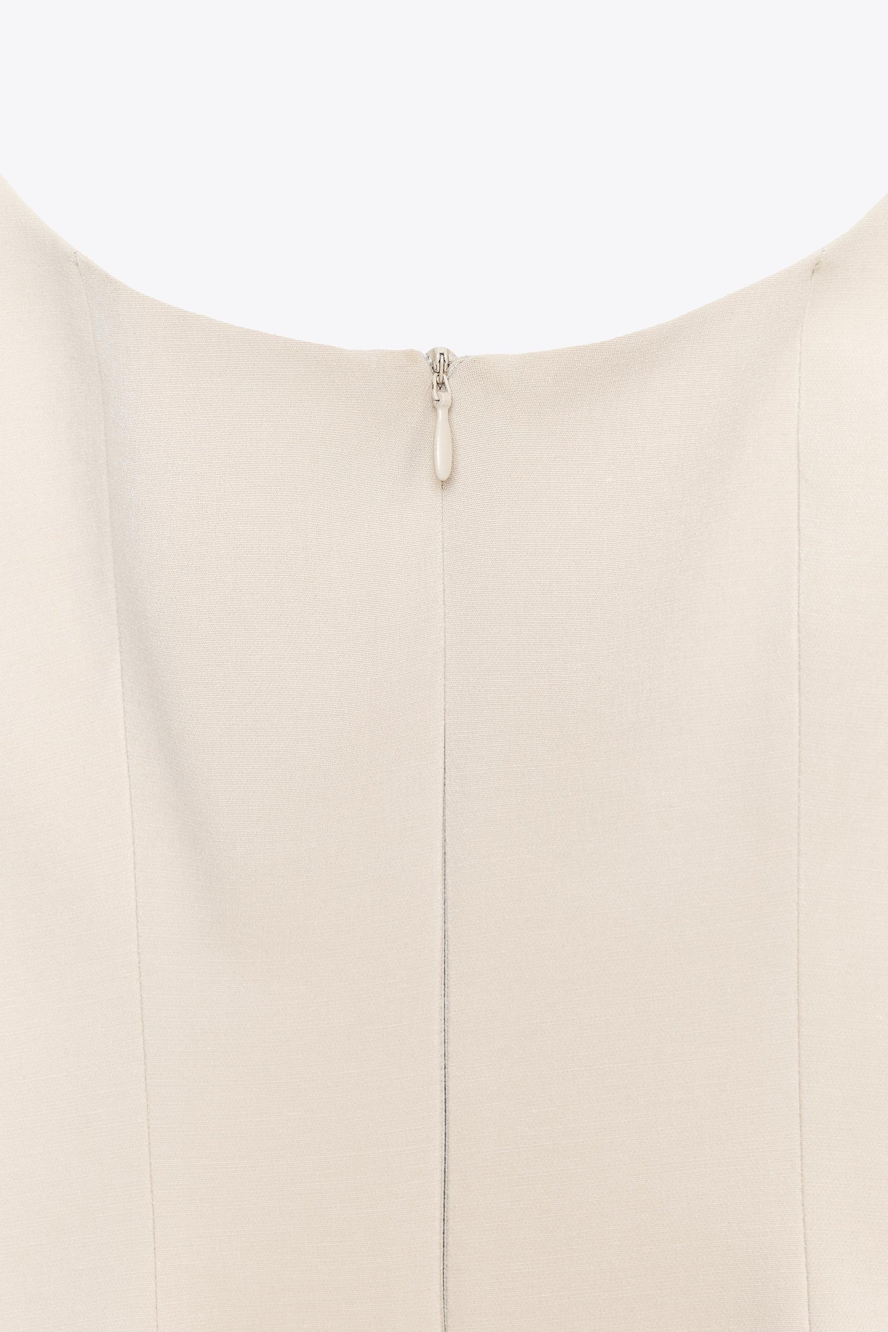 ZIPPED PEPLUM TOP