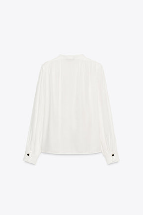 Shirt with shoulder pads