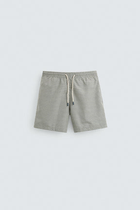 GEOMETRIC PRINT MID-LENGTH SWIMMING TRUNKS - Image 1