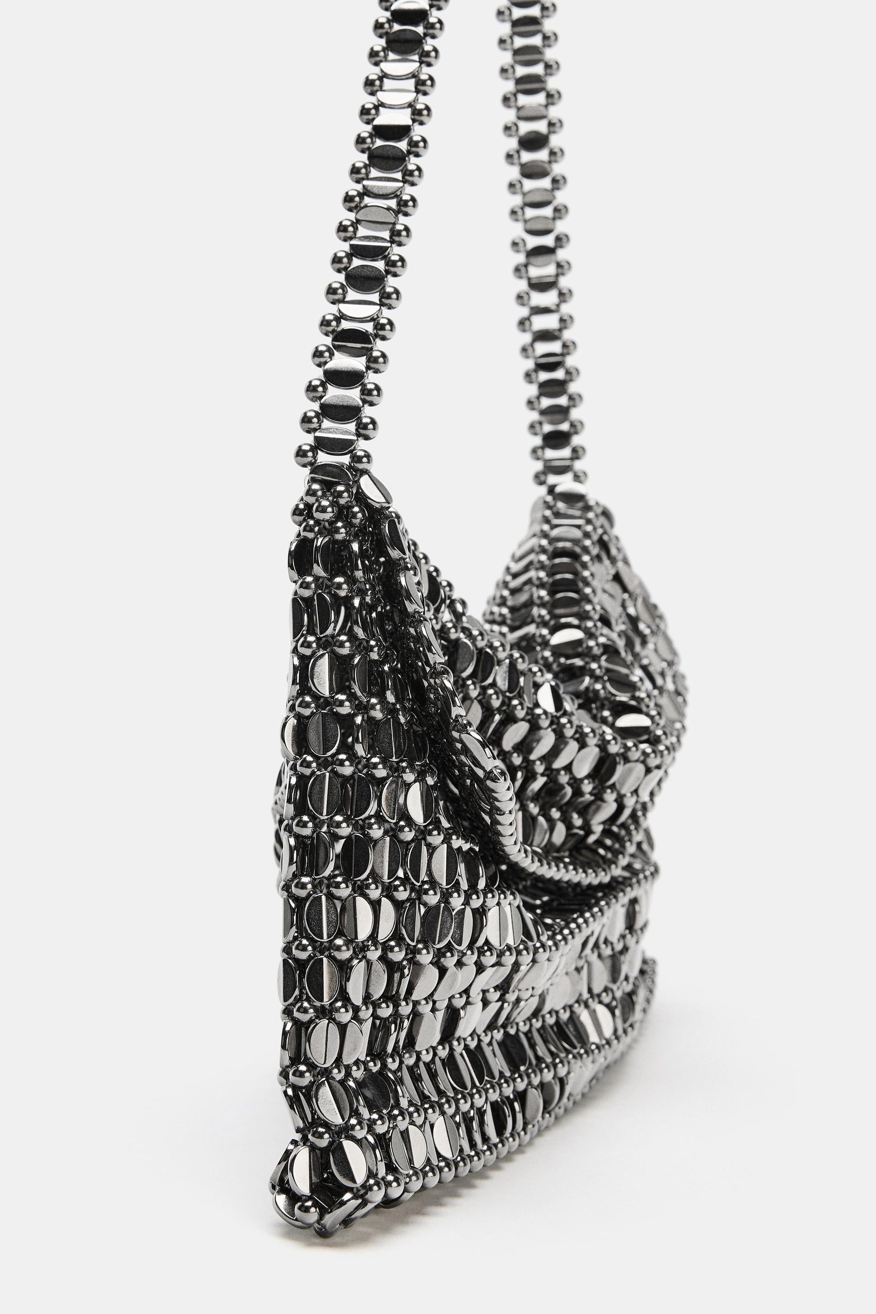 Schultertasche mit Applikationen